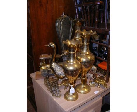 A selection of brass ware, including a model vintage car 