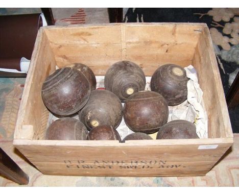 An antique Thomas Taylor of Glasgow lawn bowls set in vintage crate