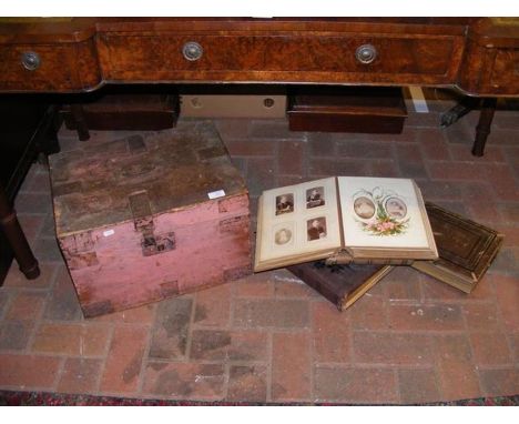A metal bound box containing various vintage photo albums