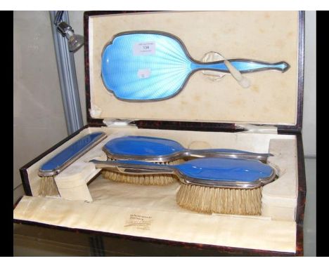 A silver and enamel cased brush set with guilloche decoration CONDITION REPORTIn our judgement, condition of lot is fair. Not