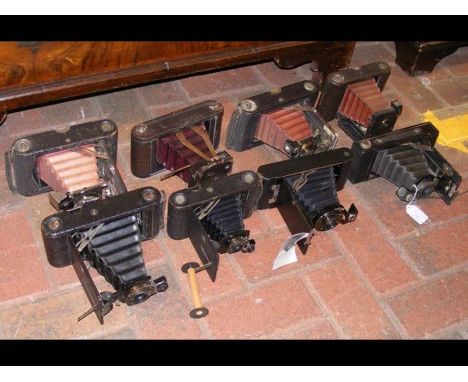 A selection of vintage folding cameras including Kodak Automatic