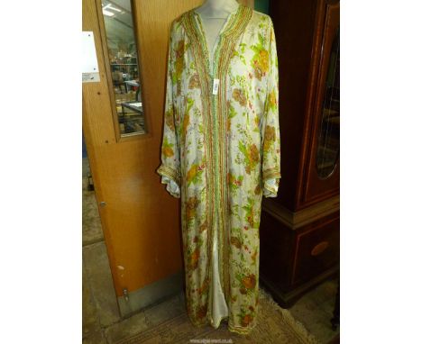 A vintage Moroccan silk Kaftan with satin under dress having orange and brown flower pattern.
