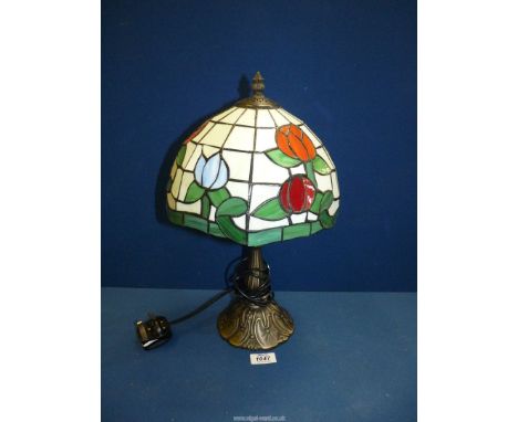 A modern Tiffany style lamp, blue, white, red and green colours, 17" tall.