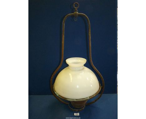 A ceiling hanging oil lamp ,converted to electric, with large white glass shade, 32'' high.