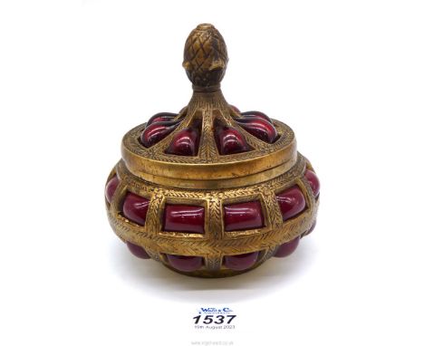 A vintage brass thick red caged bubble glass ornate trinket pot.