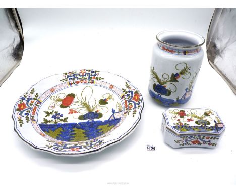 Three pieces of Italian Faenza porcelain including charger, lidded pot and utensil jar (small chip to lid of pot).