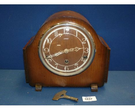 An Enfield Mantle clock with Westminster chimes, with key, 10'' x 8 3/4''.