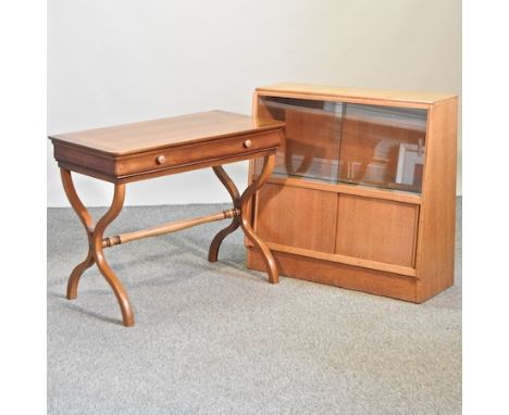 An elm writing table, 90cm, together with a 1970's light oak glazed bookcase 