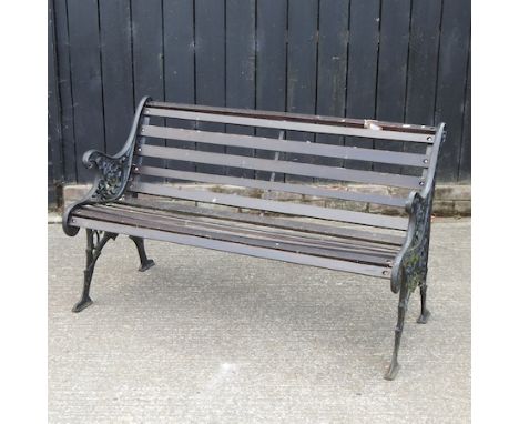 A hardwood garden bench, with cast iron ends, 125cm