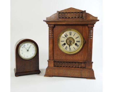 An early 20th century oak cased mantel clock, 35cm high, together with another