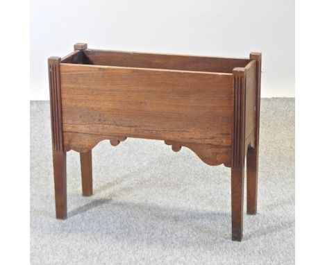An early 20th century light oak planter, with a metal liner, 73cm