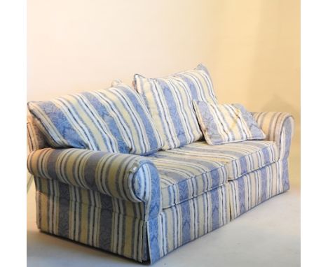 A blue and yellow upholstered three seater sofa, 230cm, together with a two seater sofa, armchair and footstool