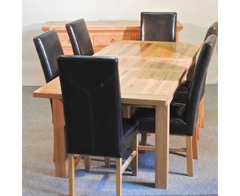 A light oak extending dining table, with two additional leaves, 270 x 95cm overall, together with six brown upholstered dinin