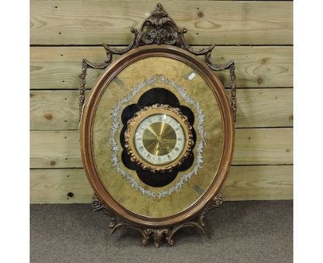 A 1960's gilt framed wall clock, 51cm high