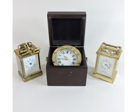A Mappin and Webb brass cased carriage clock, 11cm high, together with another carriage clock and a reproduction ship's clock
