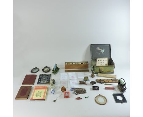 A collection of items to include snuff bottles, cribbage boards, dominoes and books