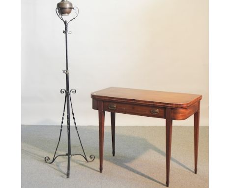 A 19th century mahogany D shaped card table, on square tapered legs, 99cm, together with a wrought iron adjustable oil lamp (