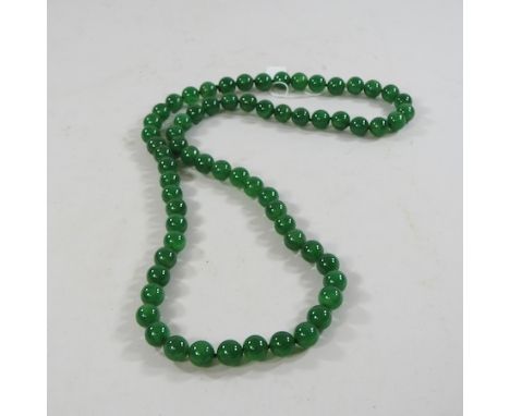 A jade coloured bead necklace