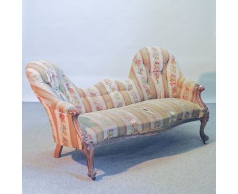 A Victorian carved mahogany and floral upholstered double ended sofa, 163cm