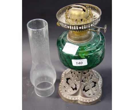 Cast metal oil lamp with ornate base