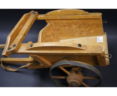 A child's vintage wooden carriage 