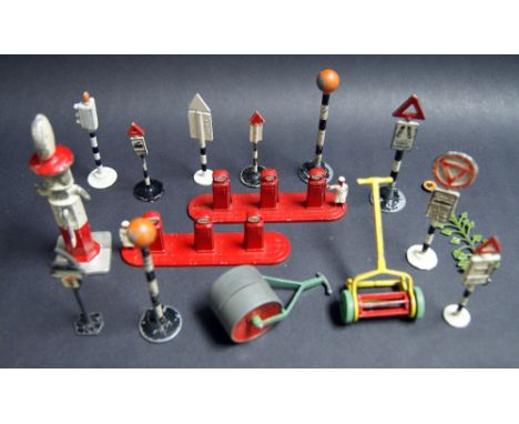 A mixed lot of vintage cast road signs, petrol pumps, and lawn mowers etc. 