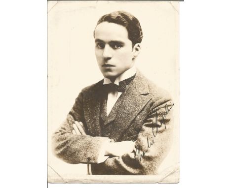 Charles Chaplin signed 7 x 5 sepia portrait photo of a young Chaplin with bow tie and tense look. Good Condition. All signed 