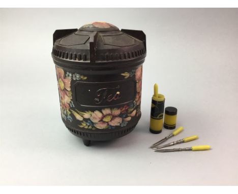 BAKELITE TEA CADDY, 10.5cm diameter; along with an Art Deco style manicure set (2)