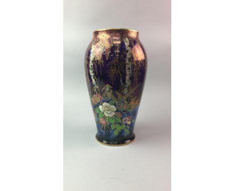 H &amp; K TUNSTALL FLORAL DECORATED VASE, in pinks, purples and blues, 30cm high; along with a Fieldings Crown Devon vase, wi