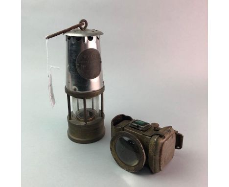 ECCLES 'THE PROTECTOR' MINING LAMP 24cm high, along with a bicycle light, binoculars, a gauge, pair of brass candlesticks and