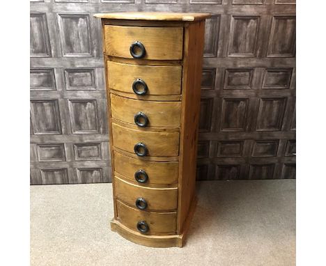 PINE BOW-FRONTED CHEST, fitted with seven drawers, 46cm wide