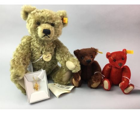 STEIFF CLASSIC BEAR, along with two smaller Steiff crimson and brown bears and a small gilt bear pendant (4)