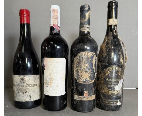Four bottles of red wine, a Proprieta Splerino, an Amarone Valpolicella and two Brunello Di Montalcino 