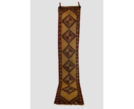 Very narrow Heriz runner, north west Persia, circa 1920s-30s, 11ft. 8in. X 2ft. 4in. 3.56m. X 0.71m.  Overall wear with moth 