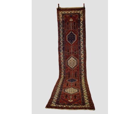 Attractive north west Persian runner, circa 1920s-30s, 14ft. 6in. X 3ft. 5in. 4.42m. X 1.04m. Slight wear in places. Terracot