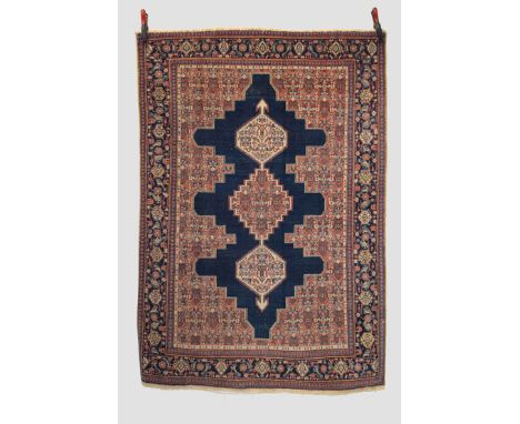 Senneh rug, north west Persia, early 20th century, 6ft. 4in. X 4ft. 4in. 1.93m. X 1.32m. Overall even wear; slight loss to to