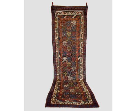 Karabakh runner, south west Caucasus, early 20th century, 12ft. 6in. X 3ft. 8in. 3.80m. X 1.12m. Overall even wear with corro