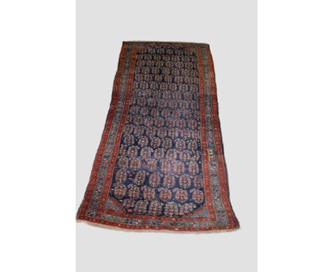 Bijar 'boteh' kelleh, north west Persia, early 20th century, 11ft. 9in. X 5ft. 2in. 3.58m. X 1.58m. Overall wear with repairs