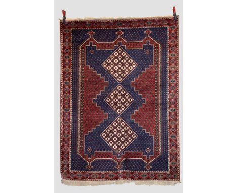 Afshar rug, Sirjan district, south east Persia, circa 1970s, 6ft. 3in. x 4ft. 7in. 1.91m. x 1.40m.  Dark blue field with red 