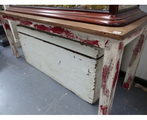 A rustic side table with painted base and a large vintage painted trunk.