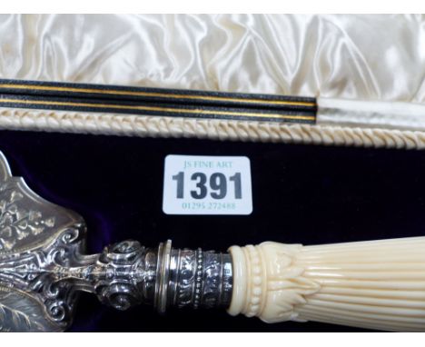 A silver presentation trowel with ivory handle in fitted case. Sheffield 1902