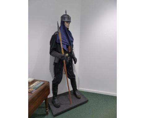 A full size male mannequin dressed in warriors outfit