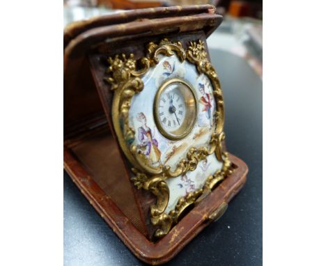 A leather cased miniature enamelled travelling clock possibly of French origin. 5.5x4cms