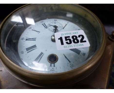 A brass cased table clock in the early 18th.c.style
