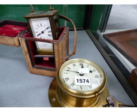 A mid 20th.c.small bulkhead clock by F.W.Elliot, Ltd. 1942, dia 12cms together with a small brass cased carriage clock with w