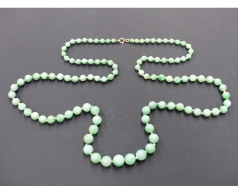 A graduated jade necklace. 81 cms long