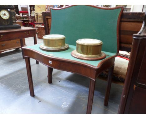 A Geo.III.mahogany fold over card table of serpentine form standing on moulded chamfer legs with later brass presentation pla