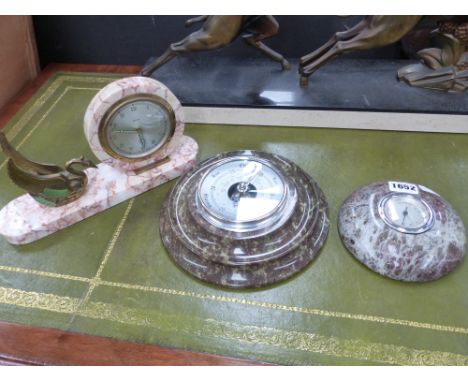 A serpentine mounted barometer, a similar thermometer and a small desk clock.