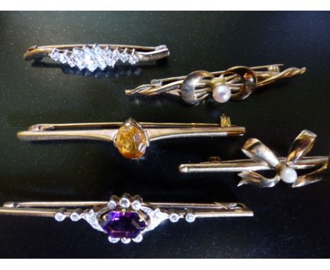 An amethyst and diamond set bar brooch and four other assorted bar brooches