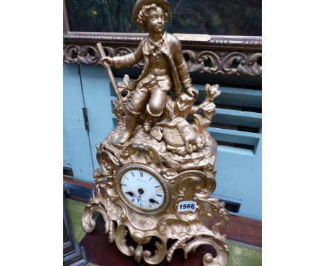 A late Victorian gilt metal mantle clock signed Conrad Pelsing surmounted with a sporting figure.